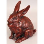 A JAPANESE BRONZE MODEL OF A RABBIT, its coat naturalistically rendered, the underside with