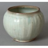 A CHINESE SONG/YUAN DYNASTY CELADON LOTUS JAR, the sides moulded with vertical petals, the base