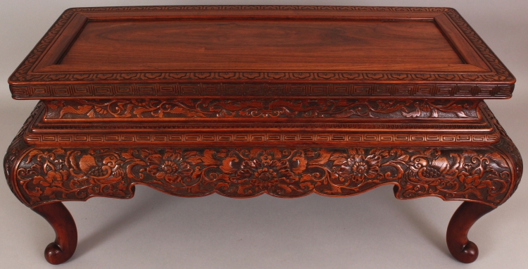 A FINE QUALITY 19TH CENTURY CHINESE RECTANGULAR CARVED HARDWOOD LOW STAND OR TABLE, the frieze