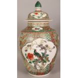 A LARGE 19TH CENTURY CHINESE FAMILLE VERTE PORCELAIN VASE & COVER, the sides painted with two