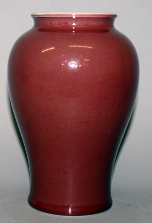 A CHINESE SANG-DE-BOEUF PORCELAIN VASE, the glaze slightly mottled, the base unglazed, 7.5in high. - Image 2 of 4