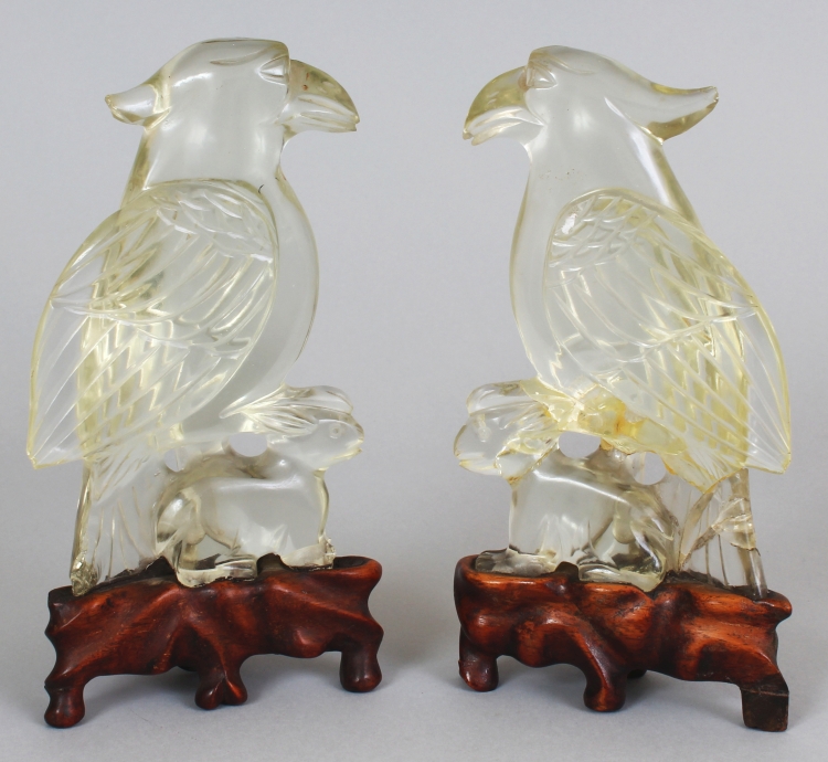 A MIRROR PAIR OF 20TH CENTURY CHINESE ROCK CRYSTAL STYLE MODELS OF A HAWK & A RABBIT, together