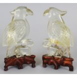 A MIRROR PAIR OF 20TH CENTURY CHINESE ROCK CRYSTAL STYLE MODELS OF A HAWK & A RABBIT, together