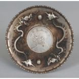 A CHINESE SILVER-METAL COIN DISH, the rim cast with dragons, 3.9in diameter.