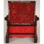 A 19TH/20TH CENTURY CHINESE RED CINNABAR LACQUER & HARDWOOD TABLE SCREEN, the screen carved with a