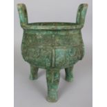 A LARGE CHINESE SHANG STYLE BRONZE TRIPOD CENSER, weighing 3.86Kg, with archaic decoration and