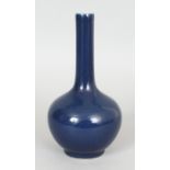 A CHINESE BLUE GLAZED MONOCHROME PORCELAIN VASE, the base with a stylised seal mark in underglaze-