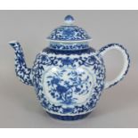 A CHINESE BLUE & WHITE PORCELAIN TEAPOT & COVER, the sides decorated with barbed panels of flowers