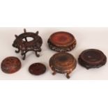 A GROUP OF FIVE 19TH/20TH CENTURY CHINESE WOOD STANDS & A WOOD JAR COVER, the largest stand 7.1in