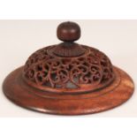 A GOOD 19TH CENTURY CHINESE CARVED HARDWOOD VASE COVER, of larger than average size, carved and