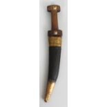 A MIDDLE EASTERN HORN HANDLED JAMBIYA DAGGER, the handle and leather sheath with brass fittings,