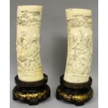 A PAIR OF JAPANESE MEIJI PERIOD IVORY TUSK VASES, together with fixed lacquered wood stands, each