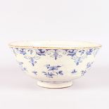 AN 18TH CENTURY TIN GLAZE BLUE AND WHITE BOWL. 10.5ins diameter.