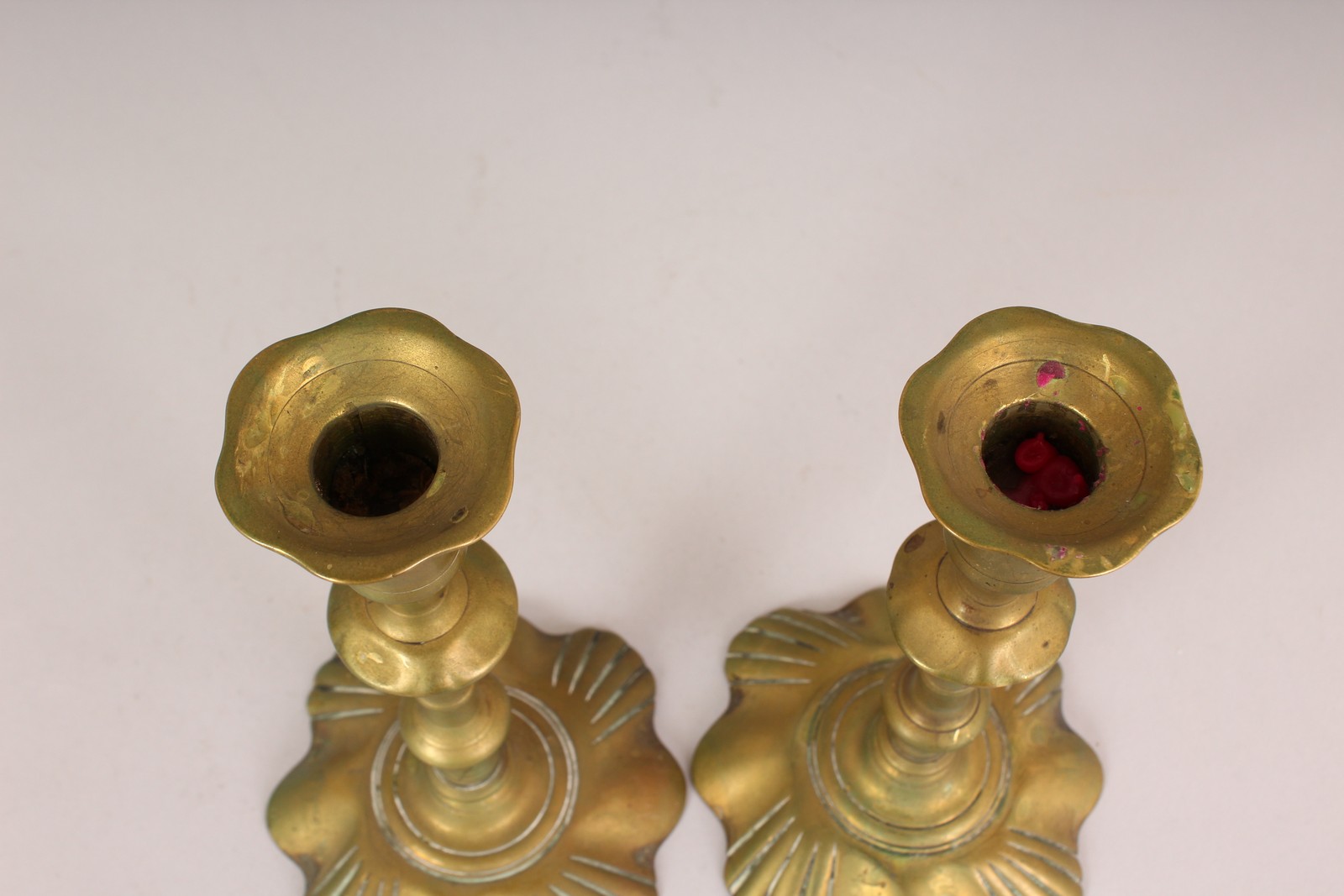 A PAIR OF EARLY PETAL BASE BRASS CANDLESTICKS. 8ins high. - Image 3 of 3