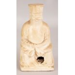 A CHINESE CREAM GLAZED MING STYLE DEHUA TYPE CRACKLEGLAZE PORCELAIN FIGURE OF A SEATED OFFICIAL, 6.