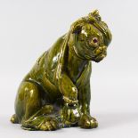 A BRETBY BROWN GLAZED POTTERY POODLE. Impressed BRETBY, No. 1348. 9ins high.