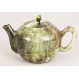 A CHINESE JADE LIKE HARDSTONE TEAPOT & COVER, the predominantly green stone with lighter and