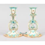 A SMALL PAIR OF BLUE AND GILT CANDLESTICKS. 6ins high.