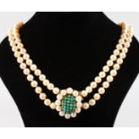 A GOOD DOUBLE ROW OF PEARLS with large yellow gold, pearl and turquoise clasp.
