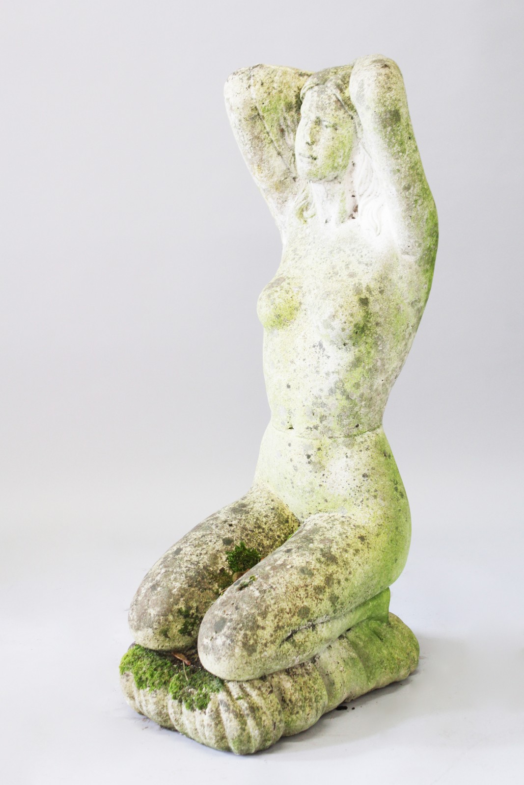 A LARGE COMPOSITION STONE KNEELING NUDE, kneeling on a cushion. 3ft 3ins high.