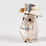 A .925 SILVER OWL VESTA with top hat and glass eyes. 2ins high.