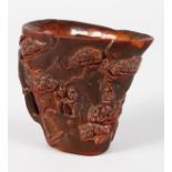 A CARVED CHINESE HORN LIBATION CUP. 4ins high.