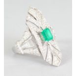 A VERY GOOD 18CT WHITE GOLD ART DECO EMERALD AND DIAMOND RING.