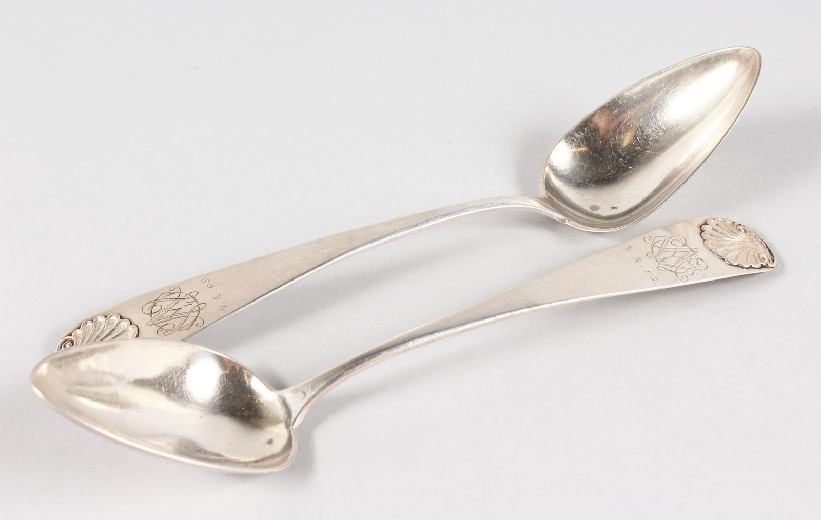 A PAIR OF CONTINENTAL 1851 SHELL TABLE SPOONS.