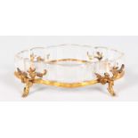 A GOOD OVAL SHAPED GLASS AND ORMOLU DISH by E. ENOT, PARIS, the ormolu with floral Chinese