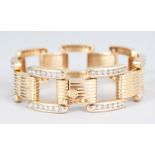 A 14CT YELLOW GOLD DIAMOND SET CARTIER STYLE BRACELET.