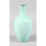 A SMALL CHINESE CELADON VASE. Printed blue mark. 8ins high.