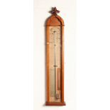 A GOTHIC OAK ADMIRAL FITZROY BAROMETER.