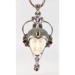 A SILVER ART NOUVEAU DESIGN FEMALE HEAD PENDANT AND CHAIN set with garnets, amethysts and peridot.