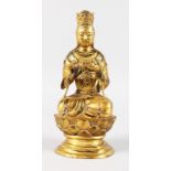 A GOOD GILT BRONZE SEATED BUDDHA. 10ins high.