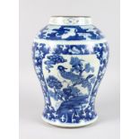 A CHINESE BLUE AND WHITE GINGER JAR with two panels of birds. 15ins high.