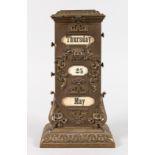 A 19TH CENTURY FRENCH BRONZE UPRIGHT THREE DIVISION CALENDAR. 11ins high.