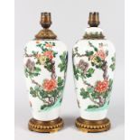 A PAIR OF SAMSON OF PARIS FAMILLE VERTE PORCELAIN VASES converted to lamps with ormolu mounts. 10ins