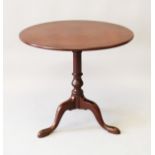 A GEORGE III MAHOGANY CIRCULAR TILT TOP TRIPOD TABLE. 2ft 4ins diameter.