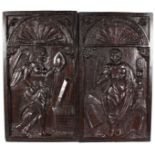 A LARGE PAIR OF 17TH CENTURY CARVED OAK PANELS, carved with figures above a dome. 19ins x 10.5ins.