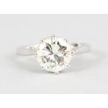 A GOOD 18CT WHITE GOLD BRILLIANT CUT SINGLE STONE DIAMOND RING, 2.25CTS, VS1 colour, K/L size.