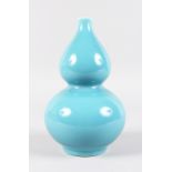 A CHINESE BLUE DOUBLE GOURD VASE. Blue mark. 9.5ins high.