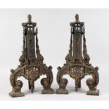 A VERY GOOD PAIR OF 18TH-19TH CENTURY FRENCH CHENETS with lion masks and scrolls. 20ins high. Need