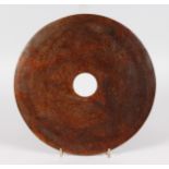 A LARGE JADE BI DISC. 12ins diameter.