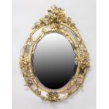 A GOOD LARGE 19TH CENTURY FRENCH OVAL GILTWOOD MIRROR, the frame decorated with leaves and