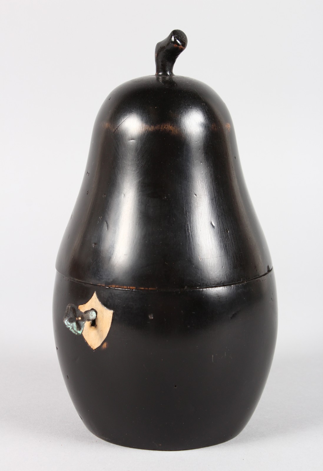 A FRUITWOOD PEAR SHAPED TEA CADDY. 7.5ins high.