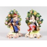 A PAIR OF SAMSON OF PARIS BOCAGE GROUPS of a young boy and girl, on scrolled bases. Derby mark in