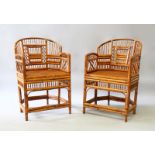 A GOOD PAIR OF BAMBOO ARMCHAIRS with canework seats.