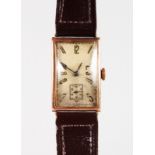 A GENTLEMAN'S 1930'S 9CT GOLD WRISTWATCH AND LEATHER STRAP.