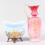 A VICTORIAN GLASS JUG decorated in pink and gilt, 11ins high, and a PALE BLUE GLASS BOWL on a gilt