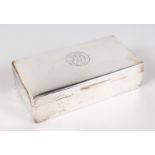A SILVER CIGARETTE BOX AND COVER . Engraved and dated 1926. 6.75ins long, 1924.